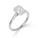 Bezel Set Emerald Cut Solitaire Diamond Engagement Ring by Harrogate Jewellers. Elegant platinum band with a stunning, earth mined diamond. Bespoke jewellery design in Harrogate, Yorkshire.