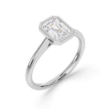 Bezel Set Emerald Cut Solitaire Diamond Engagement Ring by Harrogate Jewellers. Elegant platinum band with a stunning, earth mined diamond. Bespoke jewellery design in Harrogate, Yorkshire.