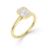 Harrogate Jewellers' Bezel Set Emerald Cut Solitaire Diamond Engagement Ring, beautifully crafted with a large natural Earth Mined Diamond, set in a platinum band, bespoke Yorkshire jewellery.