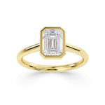 Emerald cut solitaire diamond engagement ring by Harrogate Jewellers. Bespoke, Earth mined diamond set in white gold band, Yorkshire.
