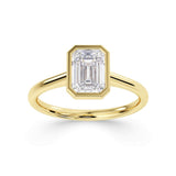 Emerald cut solitaire diamond engagement ring by Harrogate Jewellers. Bespoke, Earth mined diamond set in white gold band, Yorkshire.