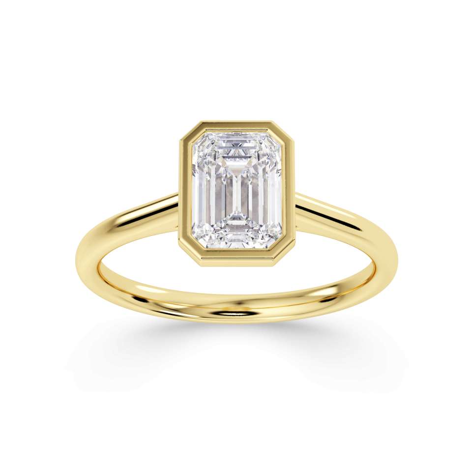 Emerald cut solitaire diamond engagement ring by Harrogate Jewellers. Bespoke, Earth mined diamond set in white gold band, Yorkshire.