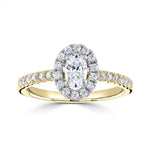 Oval Cut Diamond Halo Shoulder Set Engagement Ring by Harrogate Jewellers, featuring a central Earth Mined Diamond surrounded by smaller stones against a platinum band, representative of bespoke jewellery in Yorkshire.