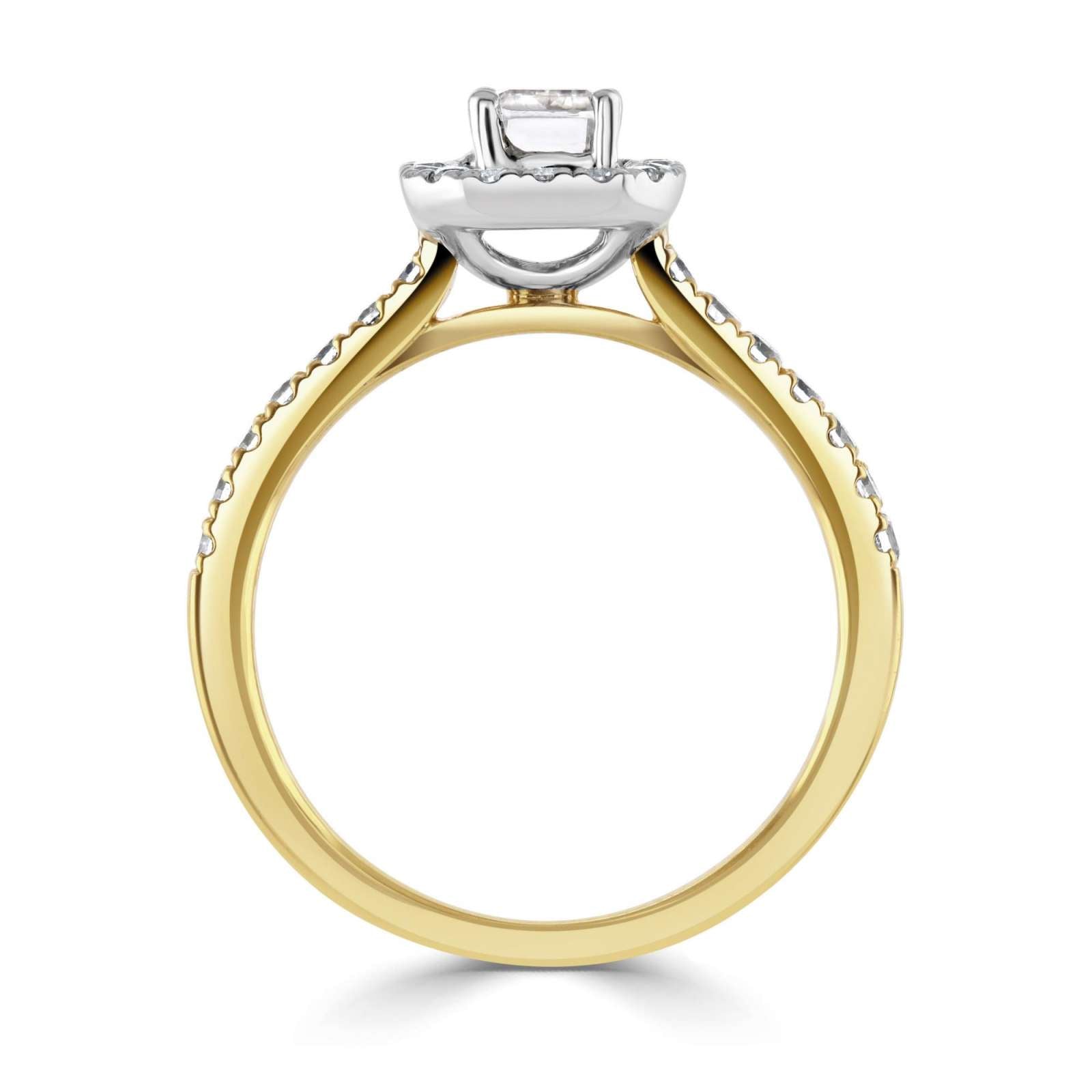 Emerald Cut Diamond Halo Shoulder Set Engagement Ring by Harrogate Jewellers, featuring a prominent diamond encircled by smaller stones on a white gold band.