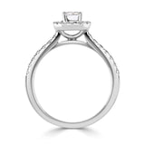 Emerald Cut Diamond Halo Shoulder Set Engagement Ring by Harrogate Jewellers, featuring a central emerald-cut diamond encircled by smaller stones on a platinum band, against a white background.