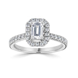 Emerald Cut Diamond Halo Shoulder Set Engagement Ring from Harrogate Jewellers, featuring a large central diamond and multiple smaller diamonds on a platinum band. Perfect for bespoke Yorkshire jewellery.