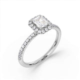 Harrogate Jewellers' 1.00ct Emerald Cut Diamond Halo Shoulder Set Engagement Ring on a white background, a perfect choice for bespoke jewellery in Harrogate, Yorkshire.